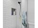 Contemporary shower with sleek white subway tile, black trim and a built-in niche at 1020 Grove St # 29, Maitland, FL 32751
