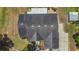 Aerial view of the dark roof of the home surrounded by lush greenery at 10528 Old Dade City Rd, Lakeland, FL 33810
