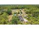 Picturesque aerial view of a home surrounded by mature trees at 10528 Old Dade City Rd, Lakeland, FL 33810