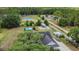 This aerial view reveals a nice home with outbuildings and lots of space for a rural-style lifestyle at 10528 Old Dade City Rd, Lakeland, FL 33810