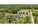 Aerial view of a home nestled among lush greenery at 10528 Old Dade City Rd, Lakeland, FL 33810