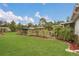 Beautiful backyard featuring a lush lawn, garden area, and mature trees at 10528 Old Dade City Rd, Lakeland, FL 33810