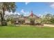 Charming single-story home with a large front yard and an American flag at 10528 Old Dade City Rd, Lakeland, FL 33810