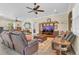 Spacious living room with plush seating, entertainment center, and tile floors at 10528 Old Dade City Rd, Lakeland, FL 33810