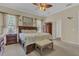Main bedroom boasting wooden furniture, a ceiling fan, and bright natural lighting at 10528 Old Dade City Rd, Lakeland, FL 33810