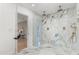 Modern bathroom with glass enclosed walk-in shower featuring luxury fixtures and marble tile at 1113 Black Acre Trl, Winter Springs, FL 32708