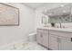 Elegant bathroom featuring dual sinks, marble countertops, and modern fixtures for a spa-like experience at 1113 Black Acre Trl, Winter Springs, FL 32708