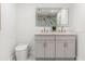 Stylish bathroom featuring dual sinks, modern fixtures, and elegant marble countertops at 1113 Black Acre Trl, Winter Springs, FL 32708