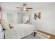Bright bedroom with hardwood floors, ceiling fan, and a view of the rest of the home at 1113 Black Acre Trl, Winter Springs, FL 32708