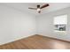 Bright, airy bedroom with hardwood floors and a modern ceiling fan at 1113 Black Acre Trl, Winter Springs, FL 32708