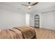 Bedroom with hardwood floors, modern fan, and double door closet at 1113 Black Acre Trl, Winter Springs, FL 32708