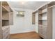 Walk-in closet with custom shelving and ample storage space for an organized wardrobe at 1113 Black Acre Trl, Winter Springs, FL 32708
