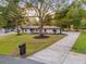 Beautiful home with a long driveway, mature trees, and green lawn at 1113 Black Acre Trl, Winter Springs, FL 32708