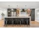 Spacious kitchen with a large island, stainless steel appliances, and modern fixtures at 1113 Black Acre Trl, Winter Springs, FL 32708