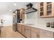 Updated kitchen features a sleek cooktop, custom cabinets, and modern appliances at 1113 Black Acre Trl, Winter Springs, FL 32708