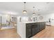 Open kitchen featuring an island, granite countertops, and stainless steel appliances at 1113 Black Acre Trl, Winter Springs, FL 32708