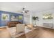 Cozy living room with hardwood floors, modern ceiling fan, and vintage leather sofa at 1113 Black Acre Trl, Winter Springs, FL 32708