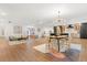 Open-concept living space with stylish furnishings, modern lighting, and hardwood floors at 1113 Black Acre Trl, Winter Springs, FL 32708