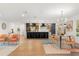 Open-concept living area flowing into a modern kitchen with a center island and stainless steel appliances at 1113 Black Acre Trl, Winter Springs, FL 32708
