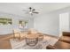 Bright living room featuring patio access to a private pool and hardwood floors at 1113 Black Acre Trl, Winter Springs, FL 32708