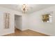 Bright living room with hardwood floors, modern lighting, and neutral paint provides an airy and stylish space at 1113 Black Acre Trl, Winter Springs, FL 32708
