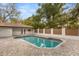 Backyard features a sparkling pool surrounded by brick pavers, perfect for outdoor entertaining at 1113 Black Acre Trl, Winter Springs, FL 32708