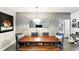 Bright dining area featuring modern lighting and seating, a mirror, and artwork at 114 Vista Verdi Cir # 136, Lake Mary, FL 32746