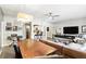 Dining area with modern lighting offering views to the kitchen, living room and balcony at 114 Vista Verdi Cir # 136, Lake Mary, FL 32746