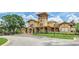 A beautiful exterior view shows the building's unique architectural details, landscaped surroundings, and inviting entrance at 114 Vista Verdi Cir # 136, Lake Mary, FL 32746