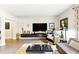 Bright living area featuring comfortable seating, mounted tv, sleek furniture and neutral walls at 114 Vista Verdi Cir # 136, Lake Mary, FL 32746
