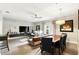 Expansive living area featuring a large tv, comfortable seating and dining area at 114 Vista Verdi Cir # 136, Lake Mary, FL 32746