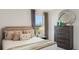 Comfortable bedroom with decor, side table, and a lovely view from the window at 1196 Alstonia Ln, Mount Dora, FL 32757