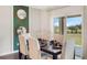 Elegant dining area with stylish decor and sliding glass doors to the patio at 1196 Alstonia Ln, Mount Dora, FL 32757