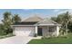 Charming single-Gathering home with a manicured lawn and a two-car garage and palm trees at 1196 Alstonia Ln, Mount Dora, FL 32757