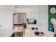 Modern kitchen featuring stainless steel appliances and a breakfast bar at 1196 Alstonia Ln, Mount Dora, FL 32757