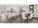 Bright and open kitchen and dining space with modern finishes and decor at 1196 Alstonia Ln, Mount Dora, FL 32757