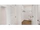A spacious walk-in closet with white wire shelving and wood floors at 1196 Alstonia Ln, Mount Dora, FL 32757