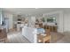Open floor plan featuring kitchen and living room with stylish furniture and bright natural light at 1200 Alstonia Ln, Mount Dora, FL 32757