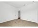 Bright bedroom with neutral carpet, and white walls at 14259 Kellogg Ave, Orlando, FL 32827