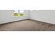 Bright bedroom with plush carpet and a large window offering a nice view at 14259 Kellogg Ave, Orlando, FL 32827