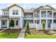 Inviting townhome showcases a modern exterior with a charming balcony and well-maintained landscaping at 14259 Kellogg Ave, Orlando, FL 32827