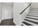 The bright foyer showcases wood floors, modern staircase, and natural light at 14259 Kellogg Ave, Orlando, FL 32827