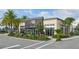 Exterior view of community gym with colorful landscaping, signage and ample parking at 14259 Kellogg Ave, Orlando, FL 32827