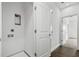 Hallway featuring a doorway, closet, and laundry hookups at 14259 Kellogg Ave, Orlando, FL 32827