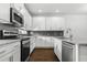 Kitchen featuring stainless steel appliances, granite countertops, and ample storage at 14259 Kellogg Ave, Orlando, FL 32827