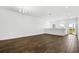 Bright, open living room with wood floors and plenty of natural light at 14259 Kellogg Ave, Orlando, FL 32827