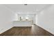 The living area boasts wood floors, neutral walls, and natural light at 14259 Kellogg Ave, Orlando, FL 32827