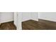 An open-concept living space with wood flooring and bright white walls at 14259 Kellogg Ave, Orlando, FL 32827