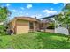 Spacious backyard with screened-in lanai and lush green grass at 1585 Maidencane Loop, Oviedo, FL 32765