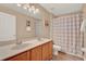 Bathroom features double sinks, a vanity, a shower, and a toilet with a tile floor at 1585 Maidencane Loop, Oviedo, FL 32765